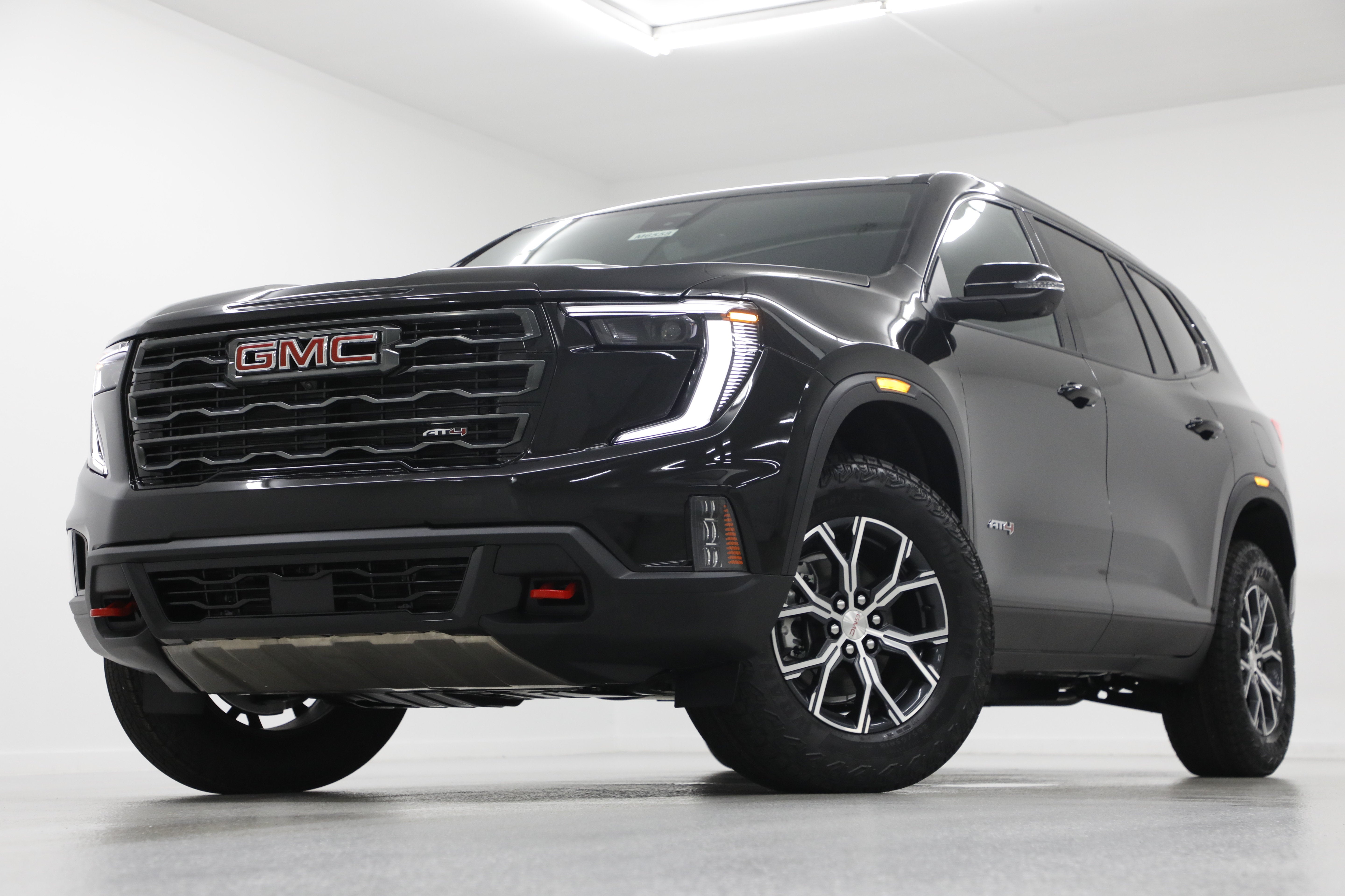 2026 GMC Acadia AT4 in Ebony Twilight Metallic — front three-quarter view