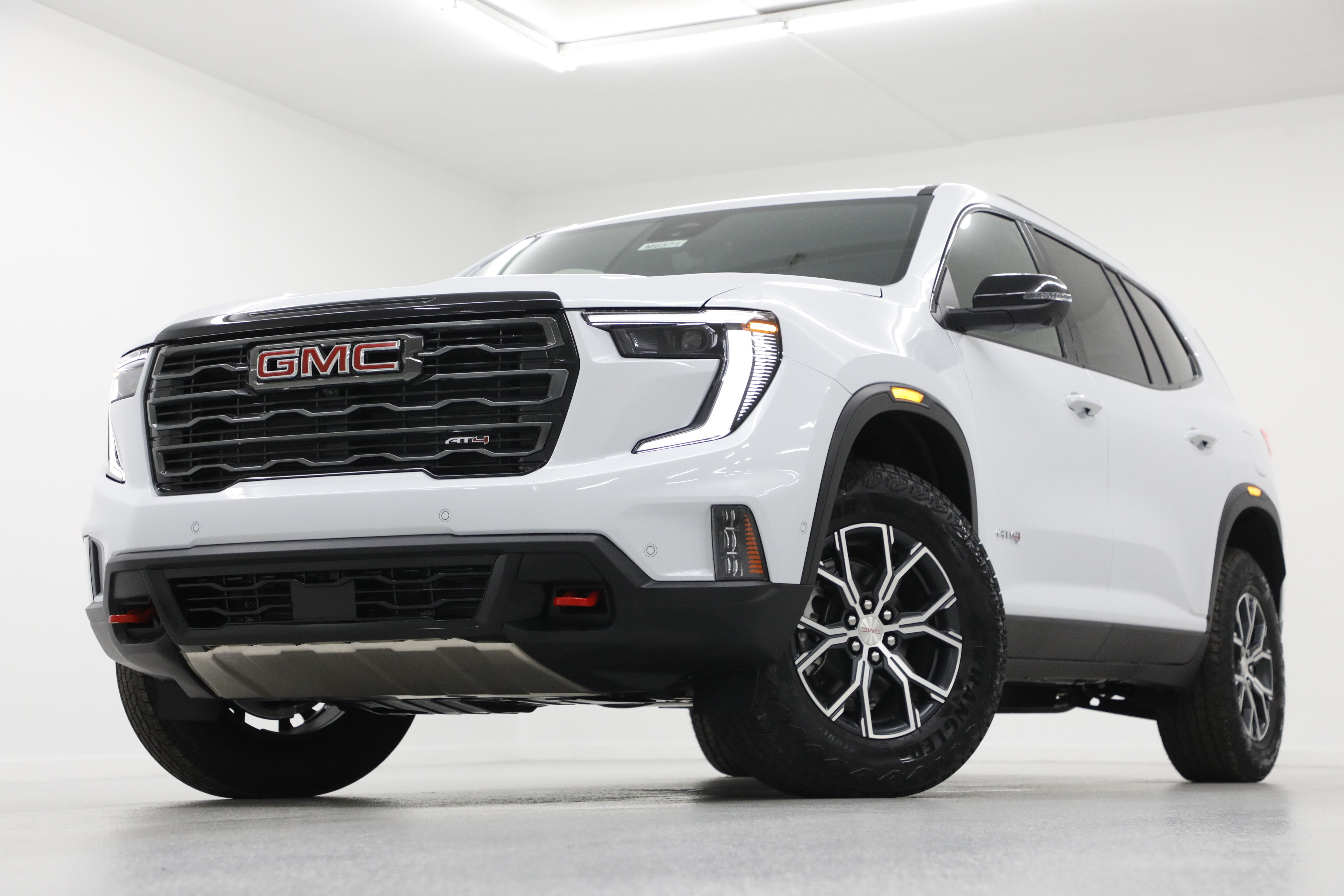 2026 GMC Acadia AT4 in Glacier White Tricoat — front three-quarter view