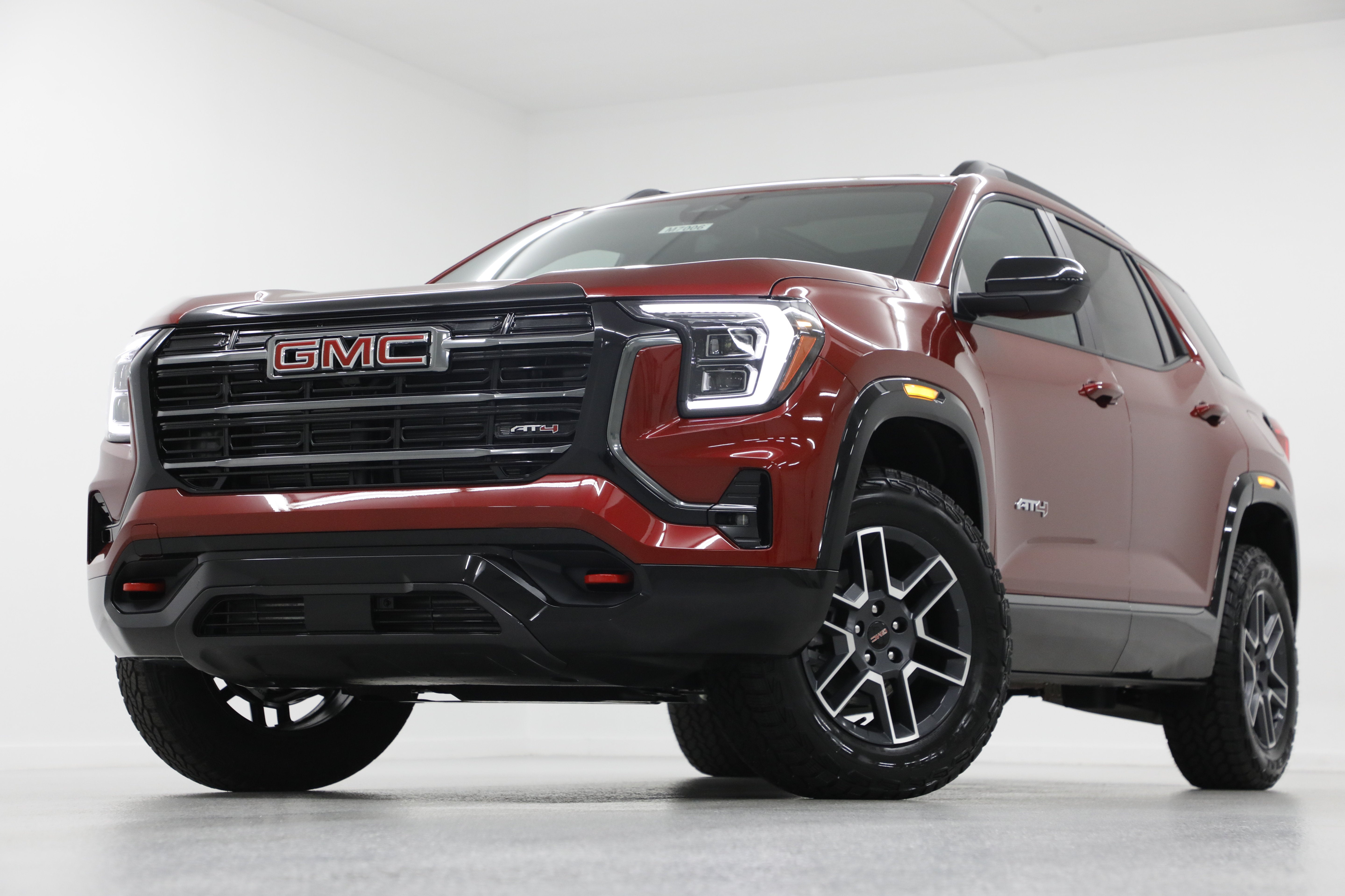 2027 GMC Terrain AWD AT4 in Volcanic Red Tintcoat — front three-quarter view